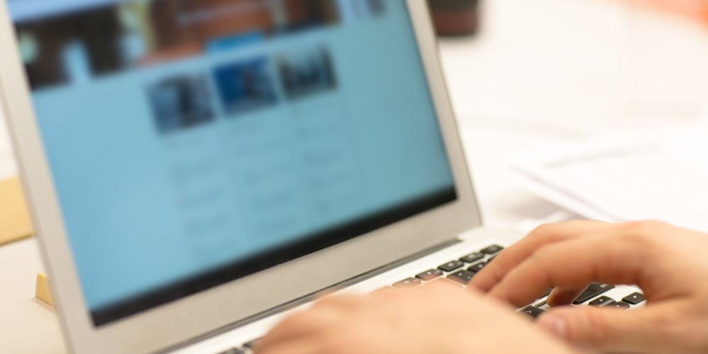 hands-typing-on-laptop